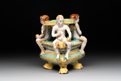 An Italian maiolica triangular salt with winged cherubs, Deruta, 17th C.