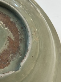 A Chinese Longquan celadon plate with floral design, Yuan/Ming