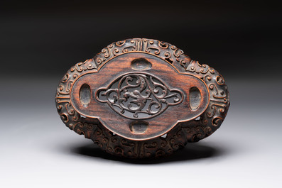 A fine Chinese teadust-glazed quadrifoil jardini&egrave;re with an openworked wooden stand, Yongzheng mark and of the period