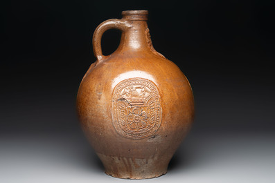 A large brown-glazed stoneware bellarmine jug, 17th C.