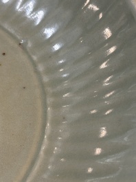 A Chinese Longquan celadon plate with floral design, Yuan/Ming