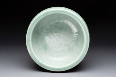 A Chinese celadon-glazed tripod censer with floral anhua design, 18/19th C.