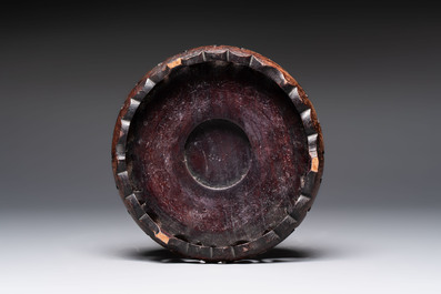 A Chinese flamb&eacute;-glazed vase on wooden stand, 19th C.
