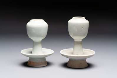 A pair of white-glazed oil lamps, a Longquan celadon vase and Yaozhou celadon box and cover, Ming/Qing