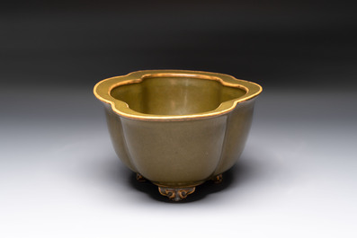 A fine Chinese teadust-glazed quadrifoil jardini&egrave;re with an openworked wooden stand, Yongzheng mark and of the period