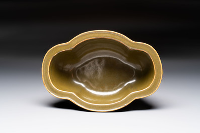 A fine Chinese teadust-glazed quadrifoil jardini&egrave;re with an openworked wooden stand, Yongzheng mark and of the period