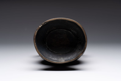 A fine Chinese archaistic bronze 'hu' vase with dragon handles, Yuan