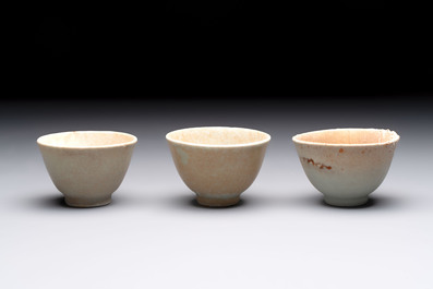 Thirteen Chinese blue and white 'Hatcher Cargo' cups and three celadon-glazed cups, Transitional period