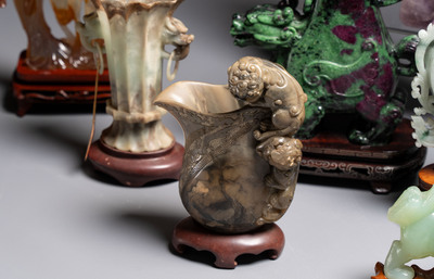 A collection of 26 Chinese jadeite, rock crystal, turquoise, agate and other hardstone carvings, 19/20th C.