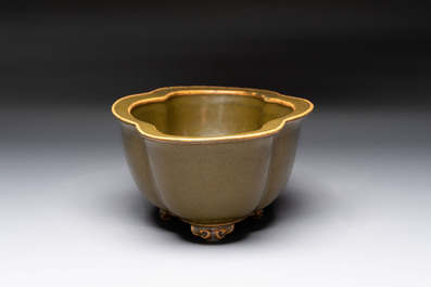 A fine Chinese teadust-glazed quadrifoil jardini&egrave;re with an openworked wooden stand, Yongzheng mark and of the period