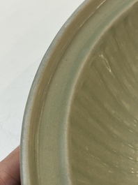A Chinese Longquan celadon plate with floral design, Yuan/Ming