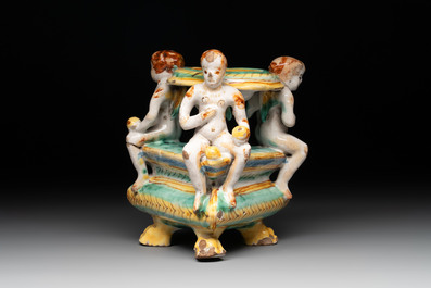 An Italian maiolica triangular salt with winged cherubs, Deruta, 17th C.