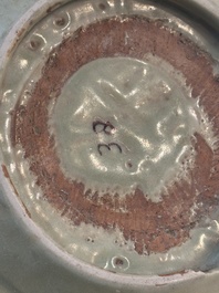 A Chinese Longquan celadon plate with floral design, Yuan/Ming