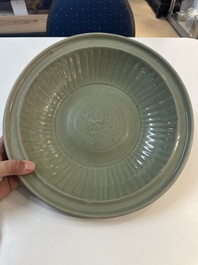 A Chinese Longquan celadon plate with floral design, Yuan/Ming