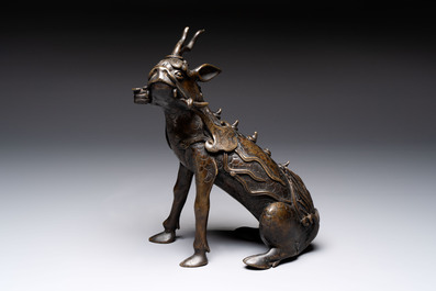 A fine Chinese bronze incense holder in the form of a qilin, Ming