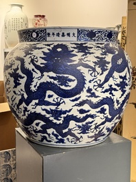 A massive Chinese blue and white 'dragon' fish bowl, Jiajing mark, 20th C.