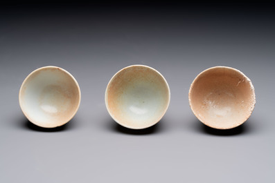 Thirteen Chinese blue and white 'Hatcher Cargo' cups and three celadon-glazed cups, Transitional period