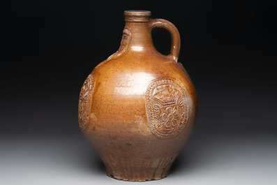 A large brown-glazed stoneware bellarmine jug, 17th C.