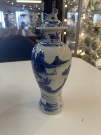 A Chinese blue and white garniture of five vases with river landscapes, 19th C.