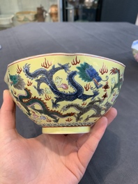 A pair of Chinese eggshell famille rose 'dragon' bowls, Qianlong mark, 20th C.
