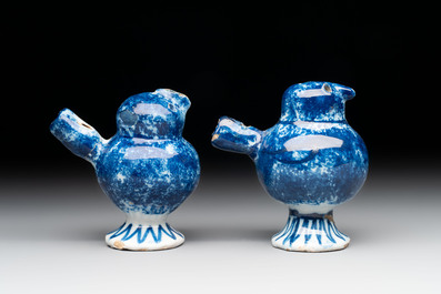 A pair of blue and white Dutch Delft 'bird' whistles, 18th C.