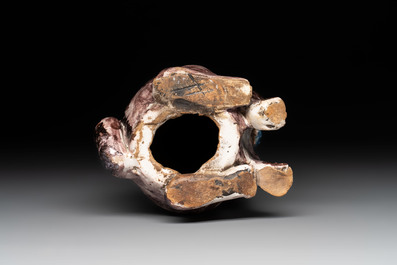 A polychrome Brussels faience model of a dog, 18th C.