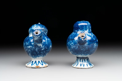 A pair of blue and white Dutch Delft 'bird' whistles, 18th C.