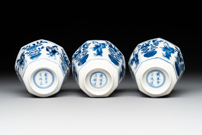 A collection of 18 Japanese blue and white cups and 17 saucers with figural and floral design, 19th C.
