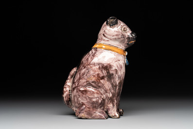 A polychrome Brussels faience model of a dog, 18th C.