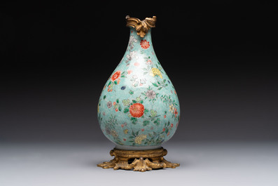 A Chinese wucai square covered container, a gilt bronze-mounted famille verte vase and a Canton famille verte bottle vase, Kangxi and later