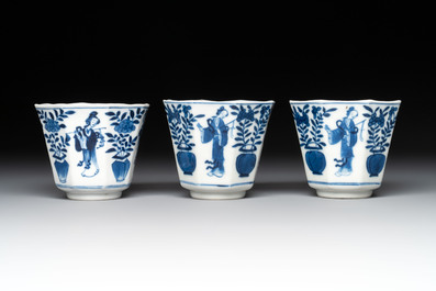 A collection of 18 Japanese blue and white cups and 17 saucers with figural and floral design, 19th C.