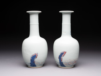 A pair of Chinese blue, white and copper-red 'bats among the clouds' vases, 19th C.