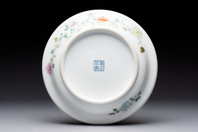 A Chinese famille rose plate with a bird and butterfly among blossoming branches, Yongzheng mark, Republic