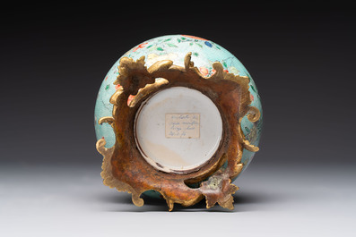 A Chinese wucai square covered container, a gilt bronze-mounted famille verte vase and a Canton famille verte bottle vase, Kangxi and later