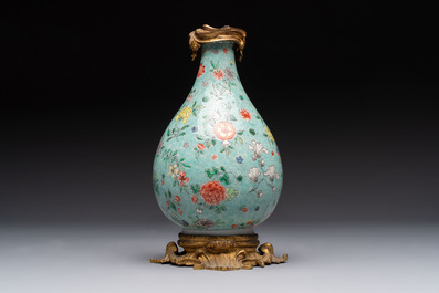 A Chinese wucai square covered container, a gilt bronze-mounted famille verte vase and a Canton famille verte bottle vase, Kangxi and later