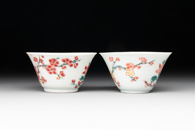 Two Chinese famille rose cups and saucers with birds and flowering branches, Yongzheng