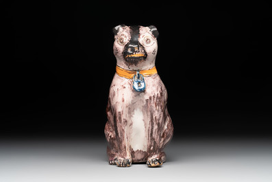 A polychrome Brussels faience model of a dog, 18th C.
