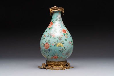 A Chinese wucai square covered container, a gilt bronze-mounted famille verte vase and a Canton famille verte bottle vase, Kangxi and later