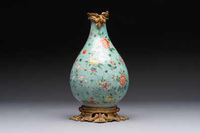 A Chinese wucai square covered container, a gilt bronze-mounted famille verte vase and a Canton famille verte bottle vase, Kangxi and later