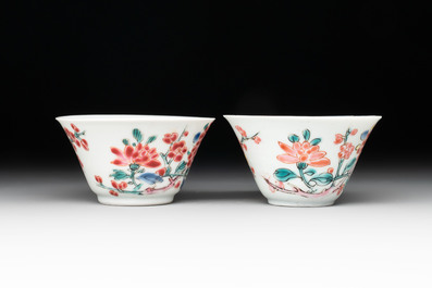 Two Chinese famille rose 'birds on flowering branches' cups and saucers, Yongzheng