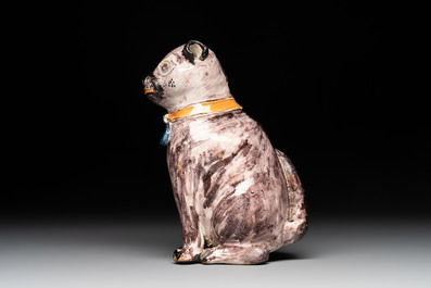 A polychrome Brussels faience model of a dog, 18th C.