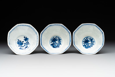 A collection of 18 Japanese blue and white cups and 17 saucers with figural and floral design, 19th C.