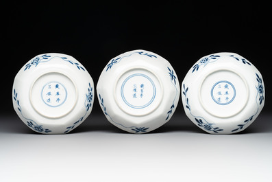 A collection of 18 Japanese blue and white cups and 17 saucers with figural and floral design, 19th C.