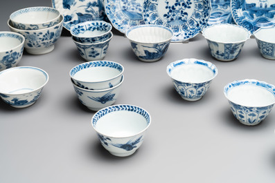 A massive collection of 32 Chinese blue and white cups and 30 saucers, Kangxi/Qianlong