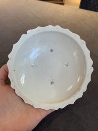 Four Chinese white-glazed saucers and three bowls, Yuan/Ming