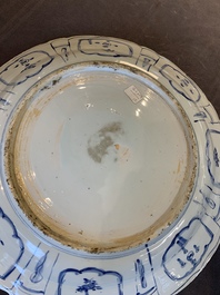 A large Chinese blue and white 'kraak' dish with birds among flowering branches, Wanli
