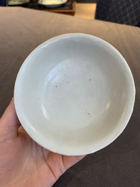 Four Chinese white-glazed saucers and three bowls, Yuan/Ming