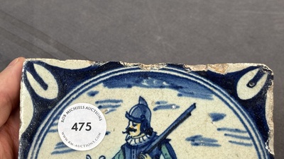A polychrome Dutch Delft maiolica 'soldier' medallion tile, late 16th C.
