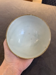 Four Chinese white-glazed saucers and three bowls, Yuan/Ming