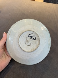 Four Chinese white-glazed saucers and three bowls, Yuan/Ming